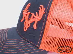 Bright neon orange and gray cap with a bright neon orange 3D embroidered deer logo.
